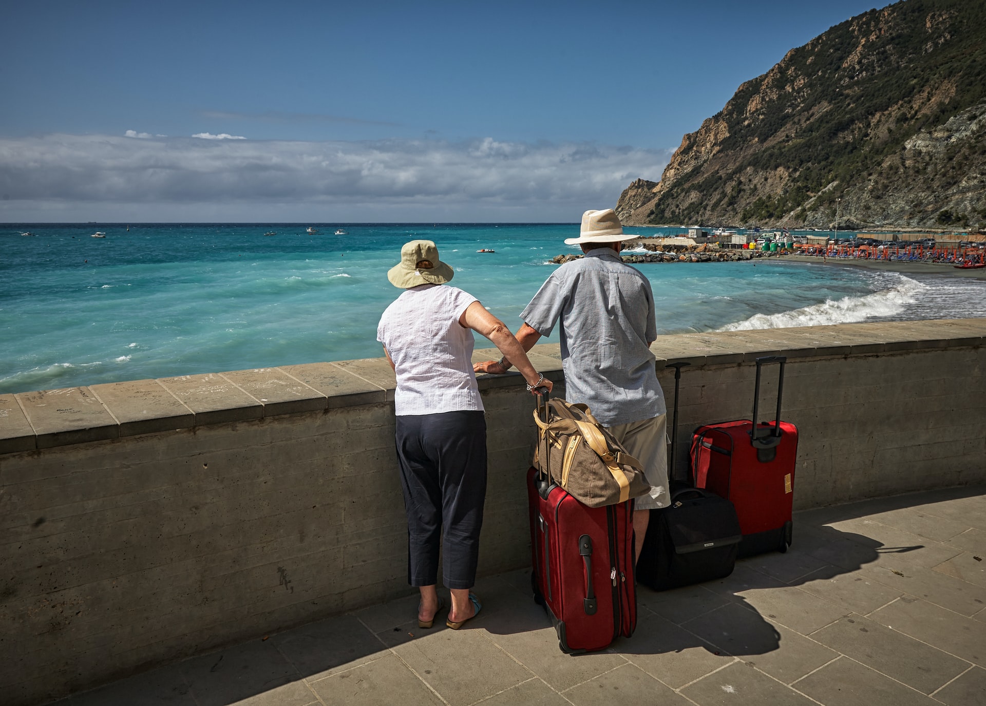 two travelers watching the sea