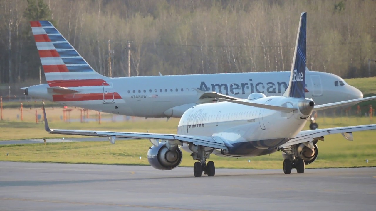 American Airlines and JetBlue planes on tarmac