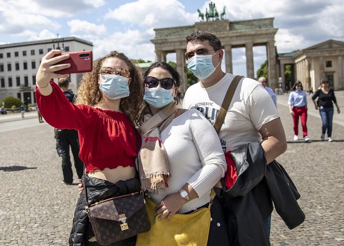 Three American tourists take a selfie in Europe