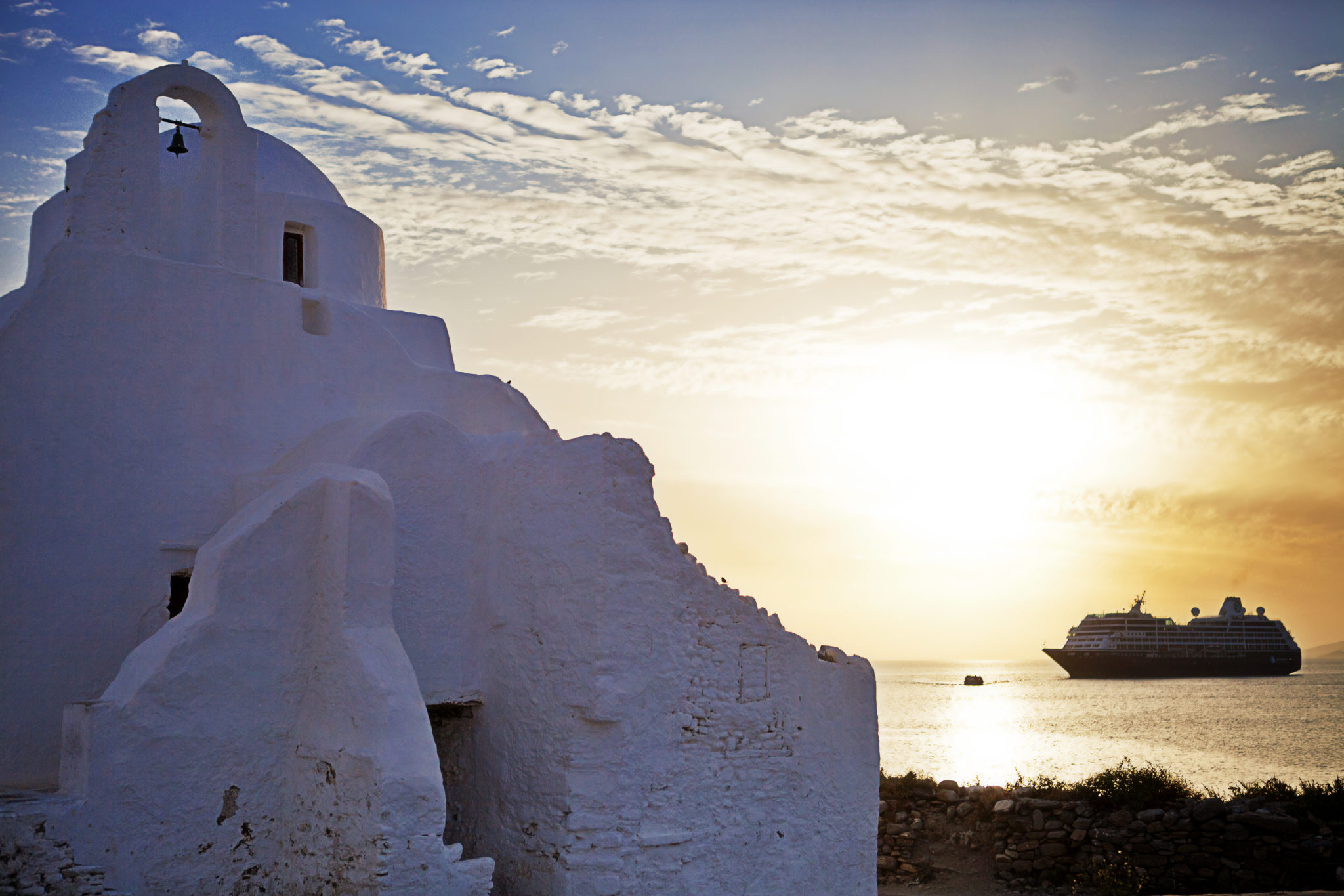 Azamara ship in the distance and piece of Greek architecture in front