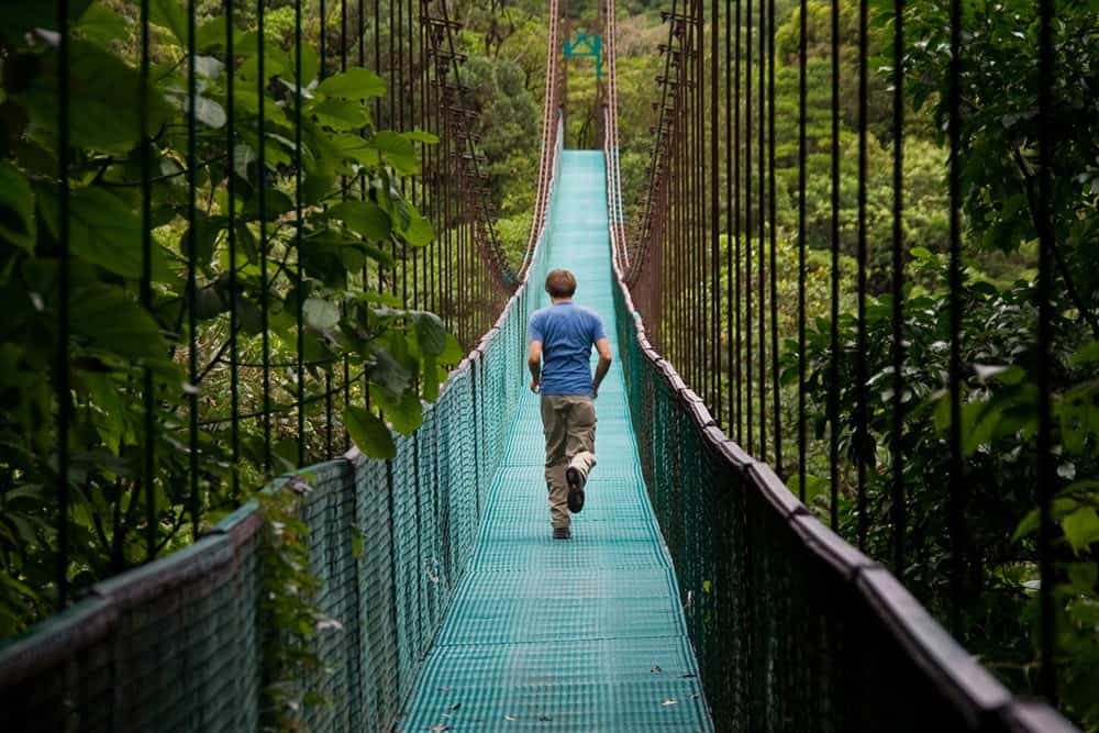 man running on a bridge