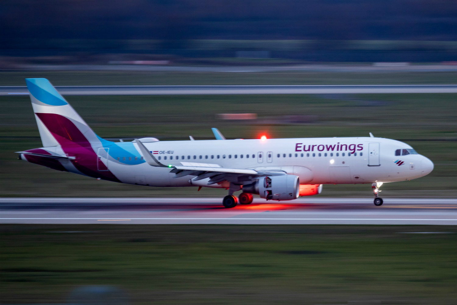 Eurowings airplane on tarmac at dusk
