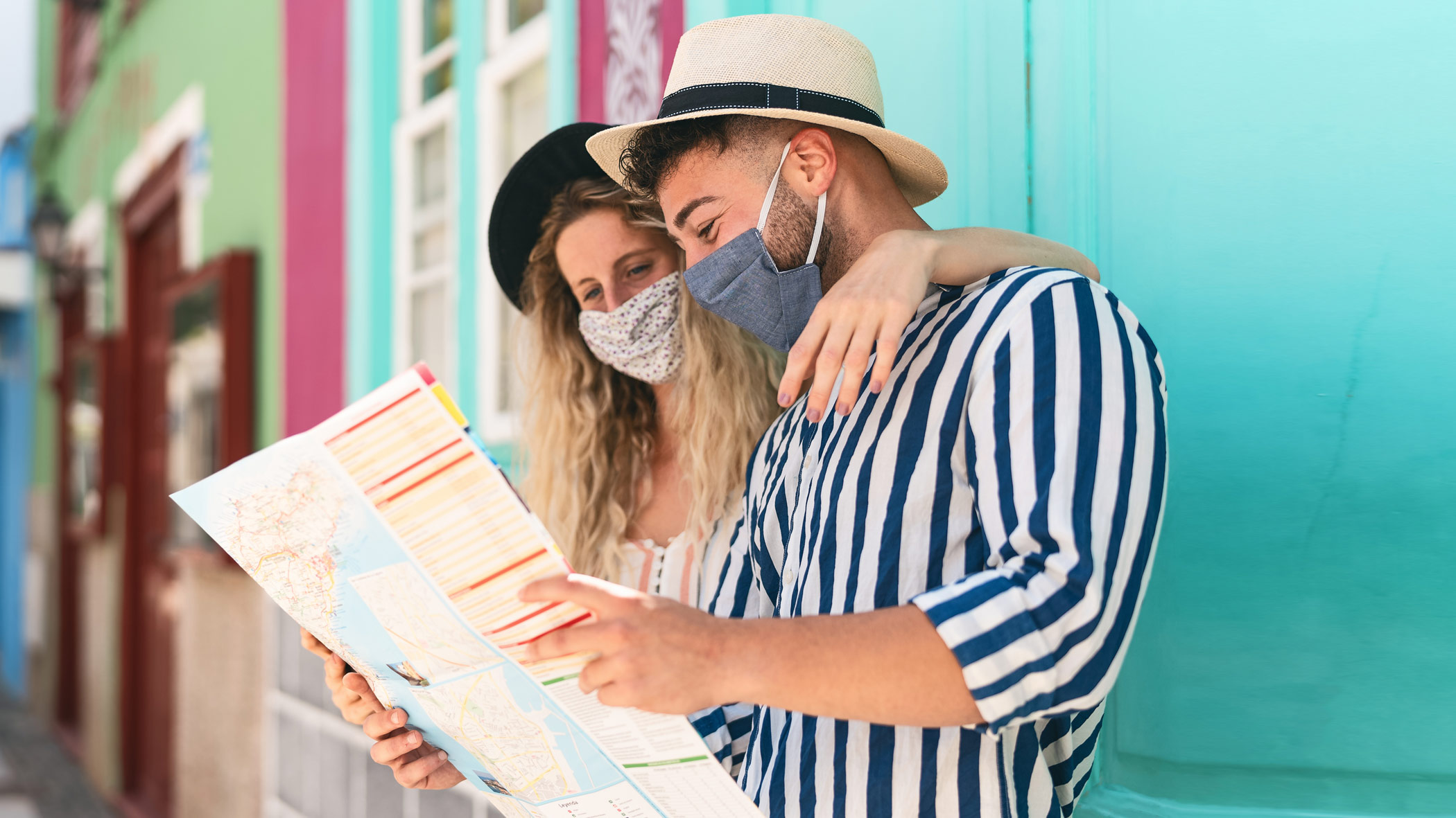 two tourists check on a map