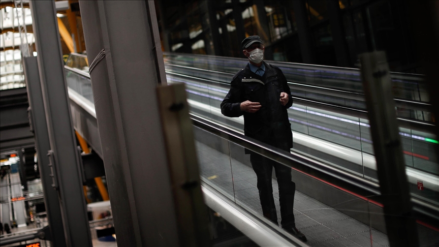 persona walking through a glass panel