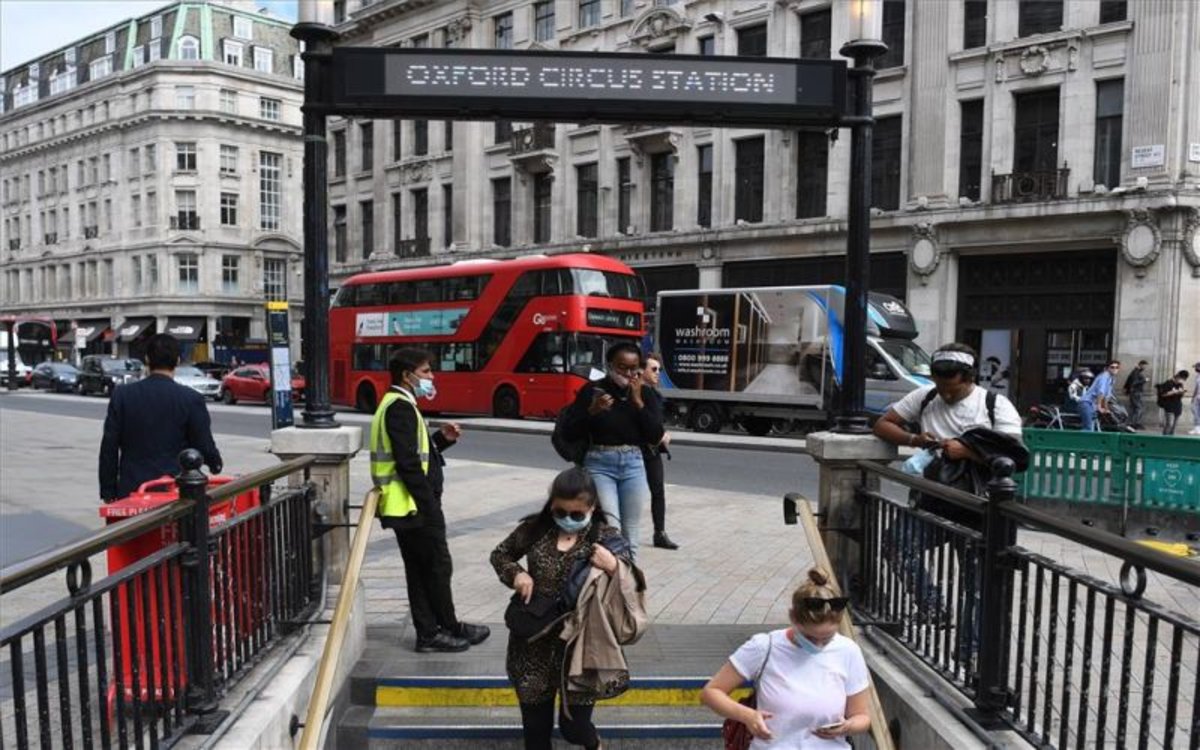 people in London, underground entrance