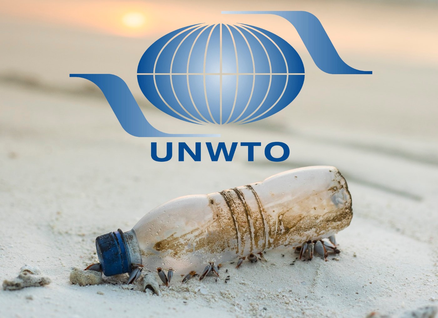 UNWTO logo, plastic bottle on a beach