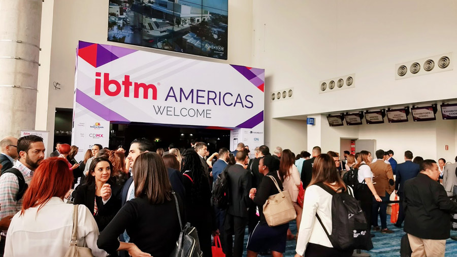 IBTM Americas welcome sign and visitors