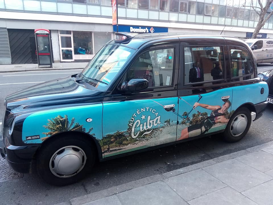 London taxi with Cuba promotion