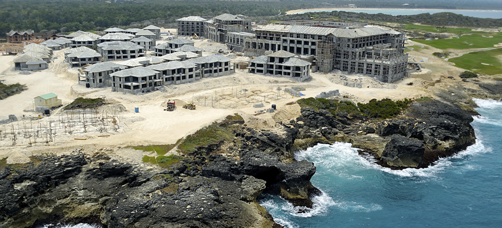 hotel under construction on a cliff by the sea