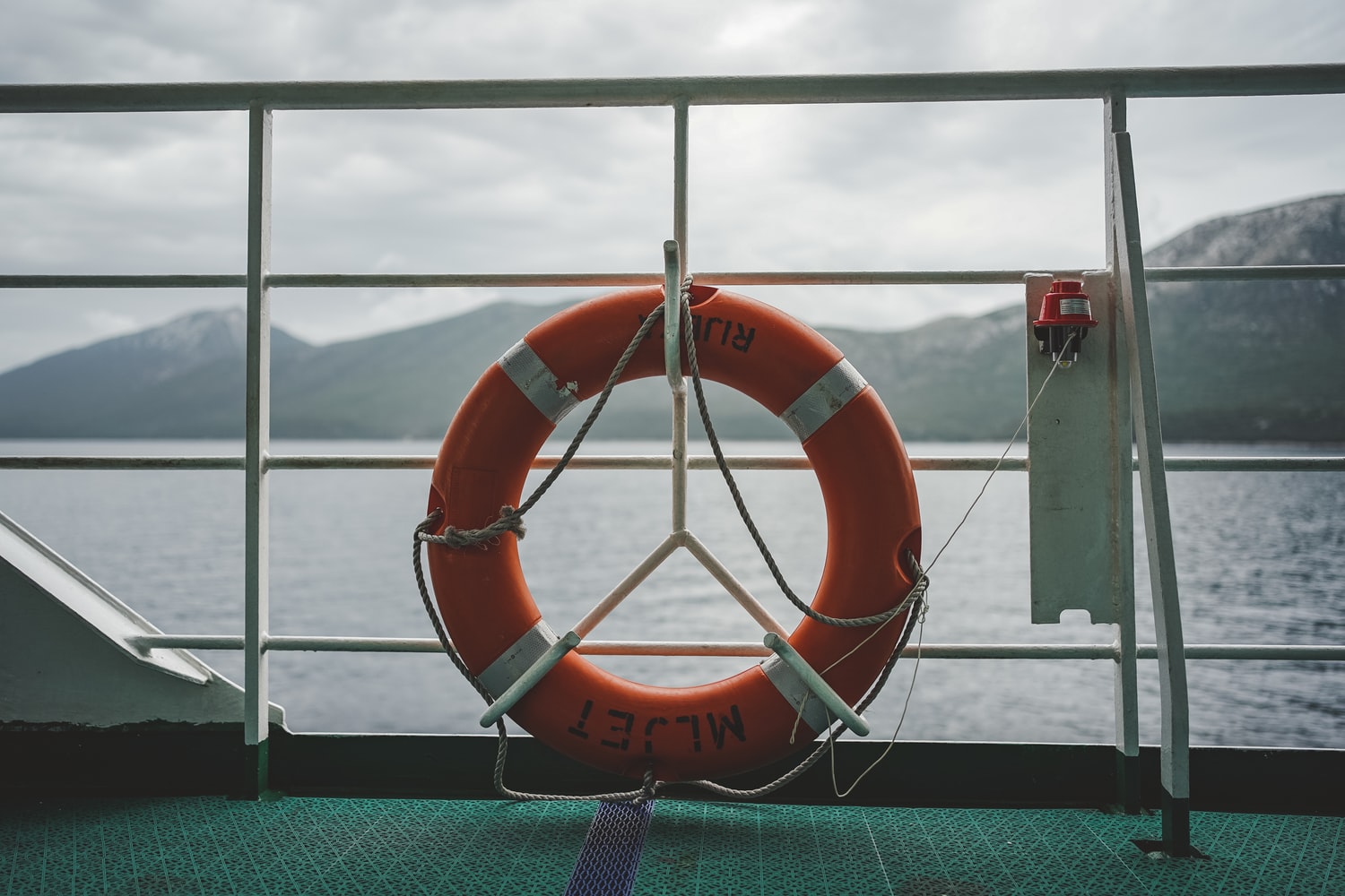 lifesaver hanging over a cruise railing