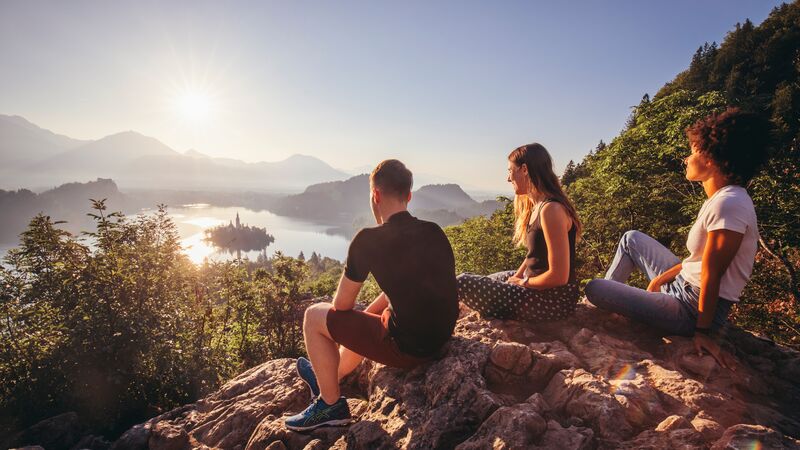 three youngsters on a mountain